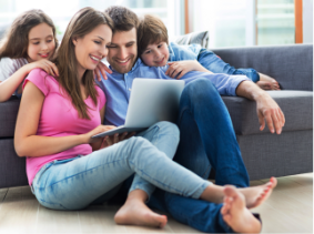 photograph of a family sitting down